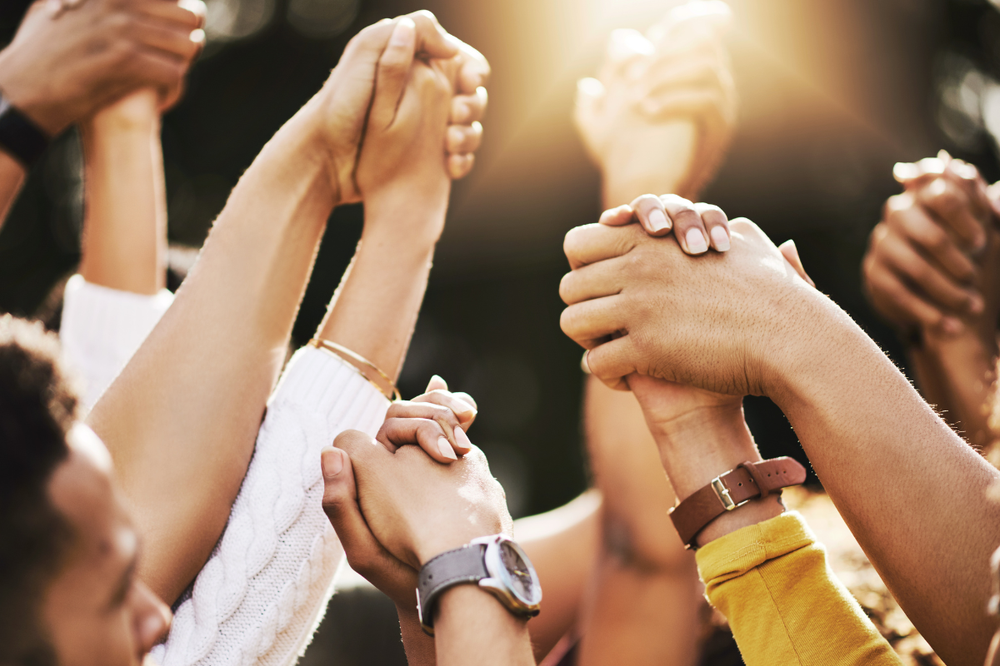 People holding hands - support